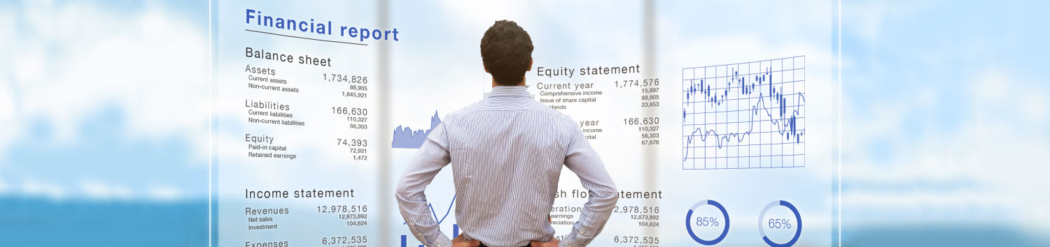 Banner_Financials_1500x350 Executive navigating multiple pieces of data with analytic